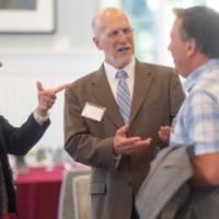 faculty happily talking